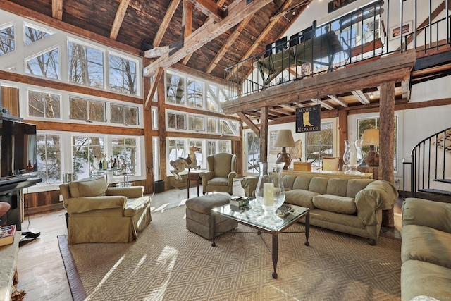 interior space featuring wooden ceiling, high vaulted ceiling, wood finished floors, and beamed ceiling