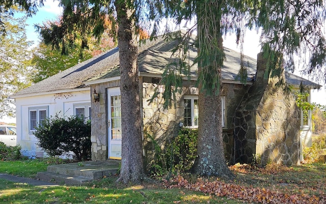 view of front of home with stone siding