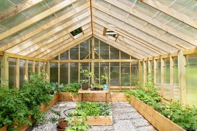 unfurnished sunroom featuring lofted ceiling