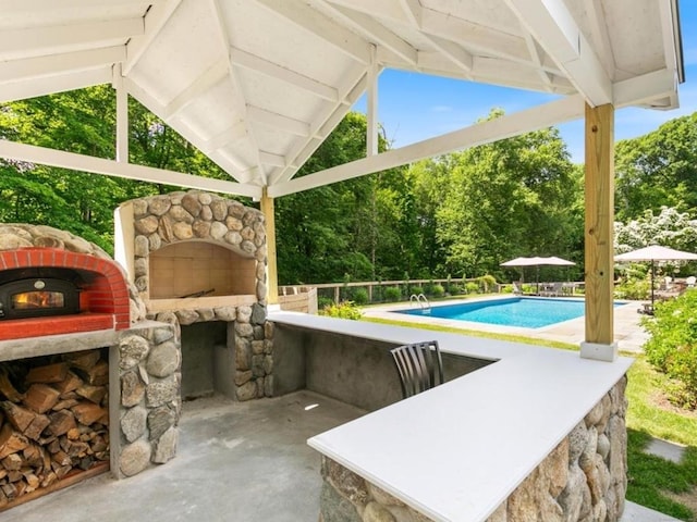 776 Bethany Mountain Rd, Cheshire, CT 06410 - view of patio / terrace featuring a fireplace, a gazebo, and view of wooded area