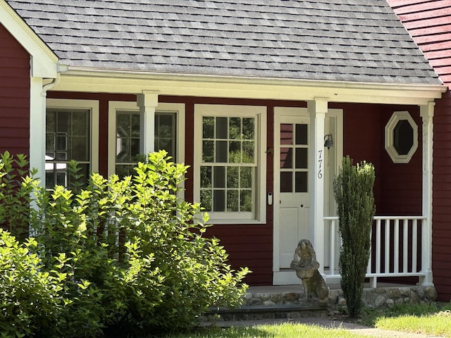 776 Bethany Mountain Rd, Cheshire, CT 06410 - doorway to property featuring roof with shingles and a porch