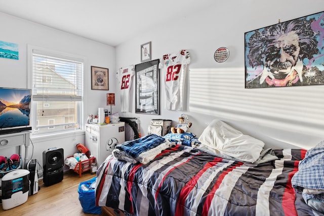 bedroom with light wood-style floors