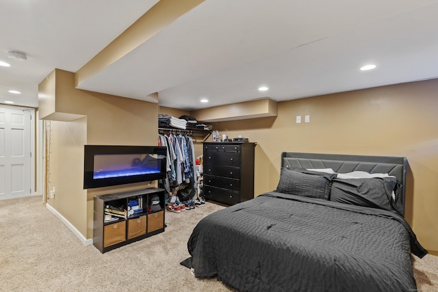 bedroom featuring baseboards, recessed lighting, and light colored carpet