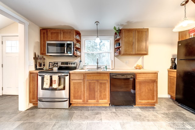 kitchen with open shelves, a sink, hanging light fixtures, light countertops, and black appliances