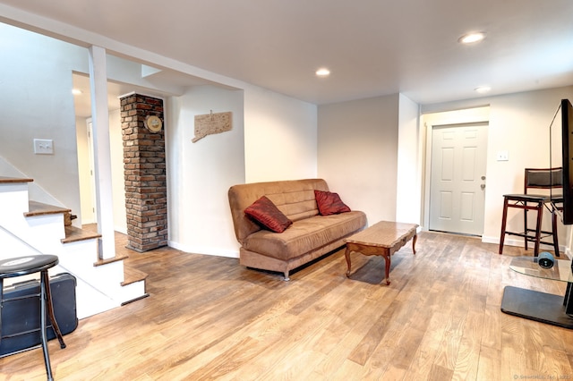 living room with baseboards, stairway, light wood-type flooring, and recessed lighting