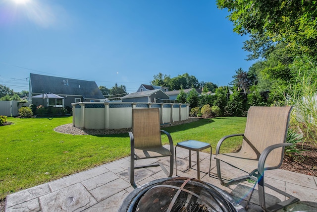 view of patio / terrace with an outdoor fire pit