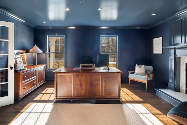 home office featuring dark wood-type flooring, recessed lighting, crown molding, and a premium fireplace