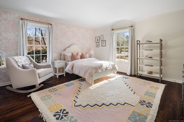 bedroom featuring ornamental molding, dark wood-style flooring, baseboards, and wallpapered walls