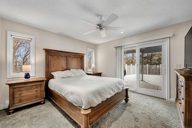 bedroom featuring access to exterior, light colored carpet, a ceiling fan, a textured ceiling, and baseboards