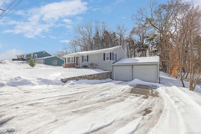 view of front of house with a detached garage