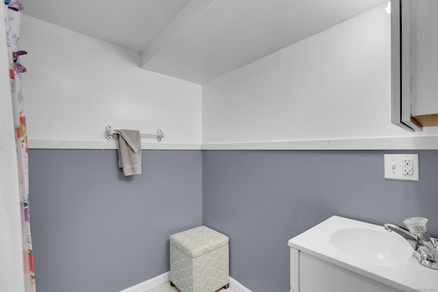 bathroom with baseboards and vanity