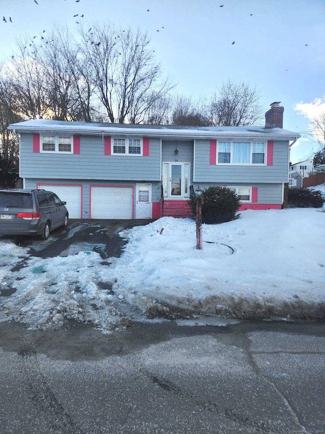 split foyer home featuring a garage