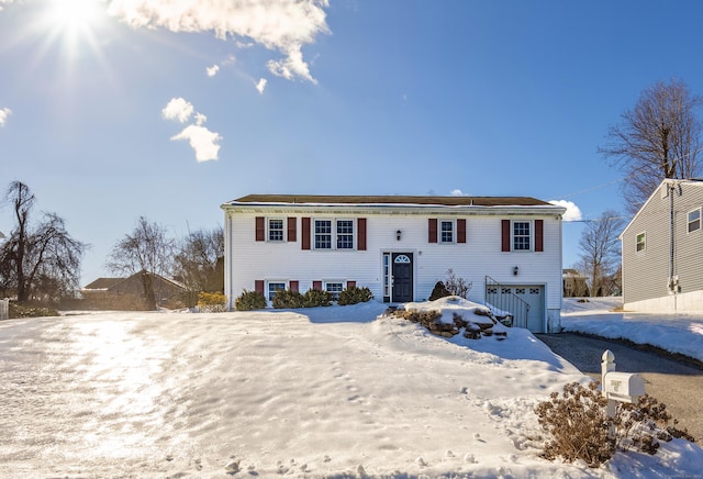 bi-level home featuring a garage