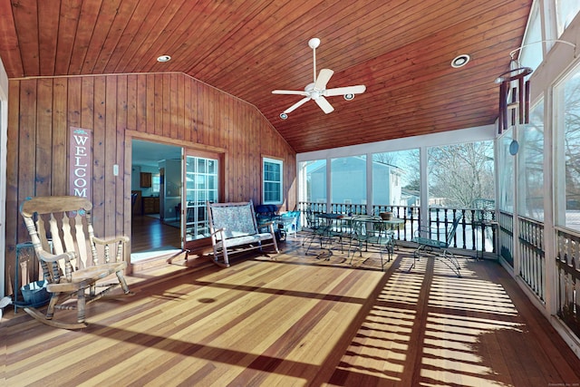 unfurnished sunroom with wooden ceiling, ceiling fan, and vaulted ceiling