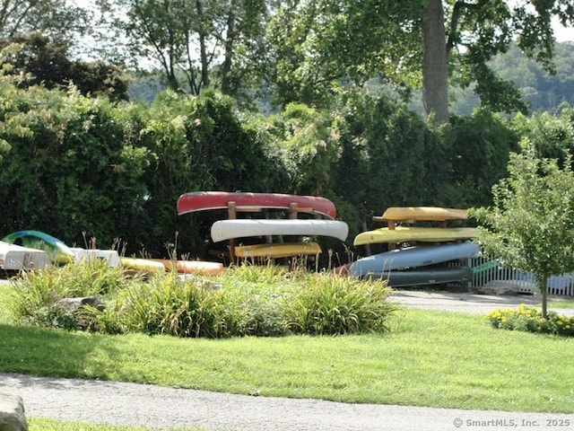 view of property's community with a lawn