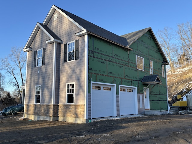 view of front of home featuring a garage and driveway