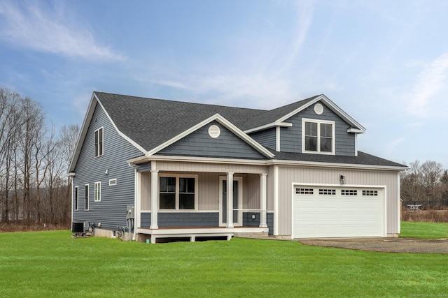 view of front of house featuring covered porch, driveway, a front yard, central AC unit, and roof with shingles