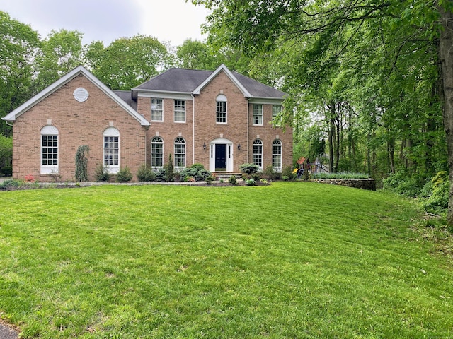 37 Independence Dr, Shelton, CT 06484 - colonial home featuring brick siding and a front yard