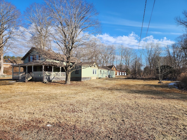 view of yard with covered porch