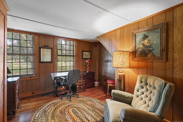 office featuring visible vents, wooden walls, and wood finished floors