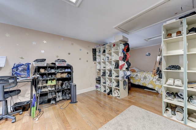 interior space featuring wood finished floors and baseboards