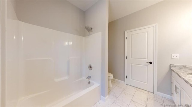 full bath with baseboards, toilet, shower / tub combination, marble finish floor, and vanity