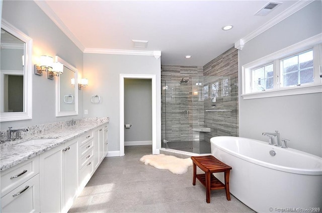 bathroom with a sink, visible vents, ornamental molding, and a shower stall