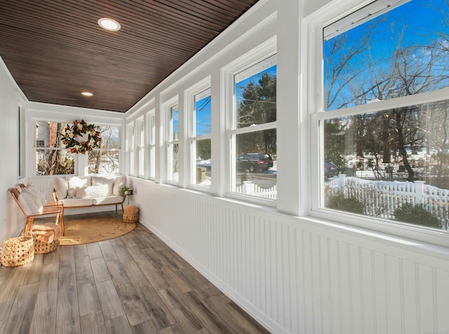 unfurnished sunroom with wooden ceiling