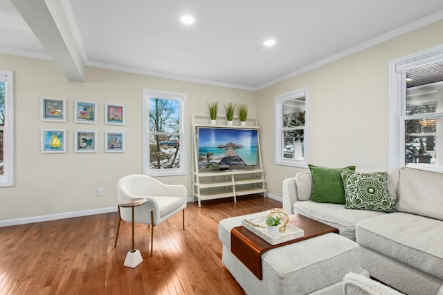 living room featuring recessed lighting, wood-type flooring, crown molding, and baseboards