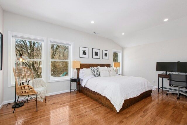 bedroom featuring lofted ceiling, hardwood / wood-style floors, baseboards, and recessed lighting