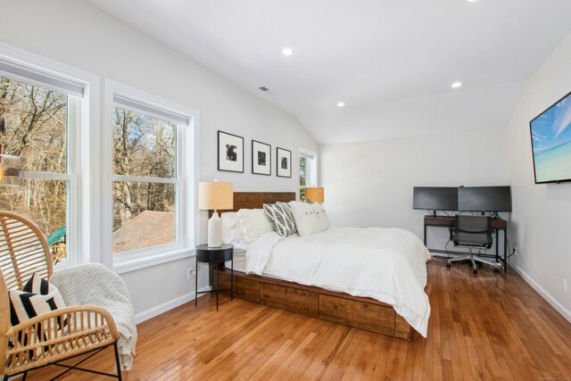 bedroom featuring lofted ceiling, light wood-style flooring, baseboards, and recessed lighting