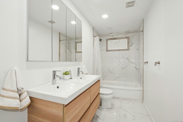 bathroom featuring marble finish floor, visible vents, toilet, shower / bath combo, and a sink