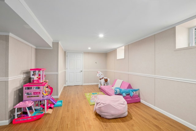 game room featuring crown molding, baseboards, wood finished floors, and recessed lighting