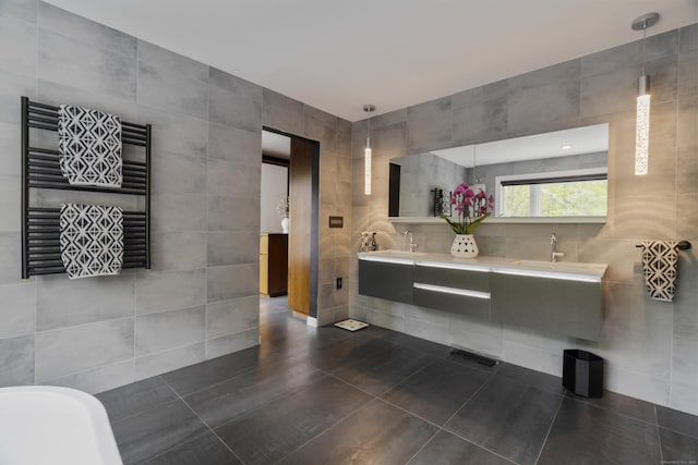 16 Whitehall Pl, Farmington, CT 06032 - bathroom featuring tile walls, radiator heating unit, a towel warmer, double vanity, and tile patterned flooring
