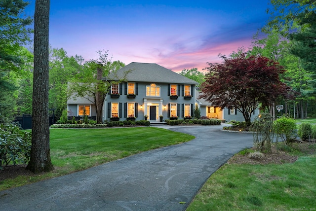 16 Whitehall Pl, Farmington, CT 06032 - colonial house with asphalt driveway, a front lawn, and a chimney