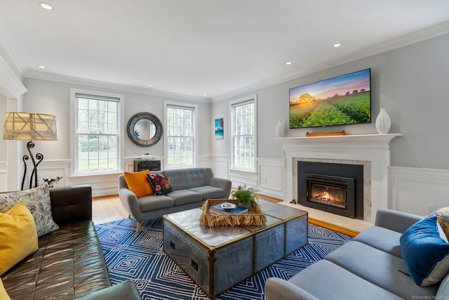 16 Whitehall Pl, Farmington, CT 06032 - living area featuring a glass covered fireplace, wood finished floors, recessed lighting, wainscoting, and crown molding