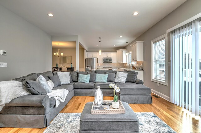 40 Newbury Ct Unit 40, North Haven, CT 06473 - living area with a chandelier, light wood-type flooring, and recessed lighting