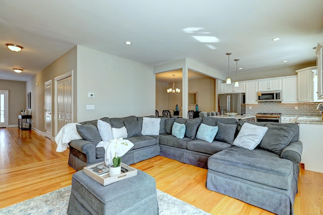 40 Newbury Ct Unit 40, North Haven, CT 06473 - living area with a chandelier, light wood-style floors, and recessed lighting