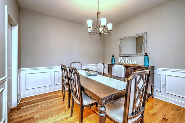 40 Newbury Ct Unit 40, North Haven, CT 06473 - dining area with a chandelier, light wood-style floors, wainscoting, and a decorative wall