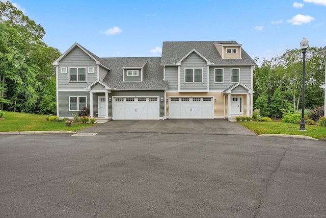 40 Newbury Ct Unit 40, North Haven, CT 06473 - view of front of property with driveway, a shingled roof, an attached garage, and a front lawn