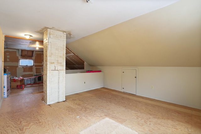 additional living space with vaulted ceiling