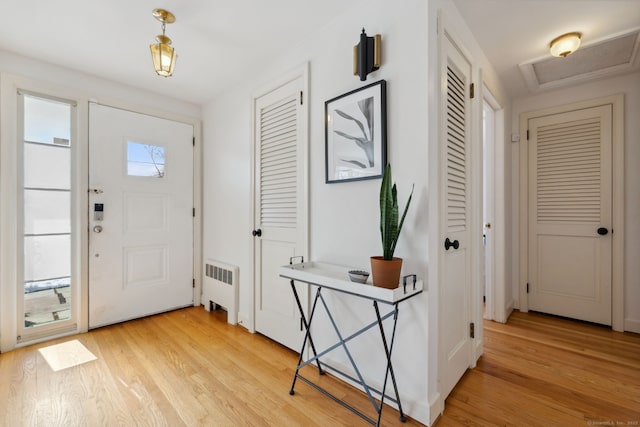 entryway featuring radiator and light wood-style flooring