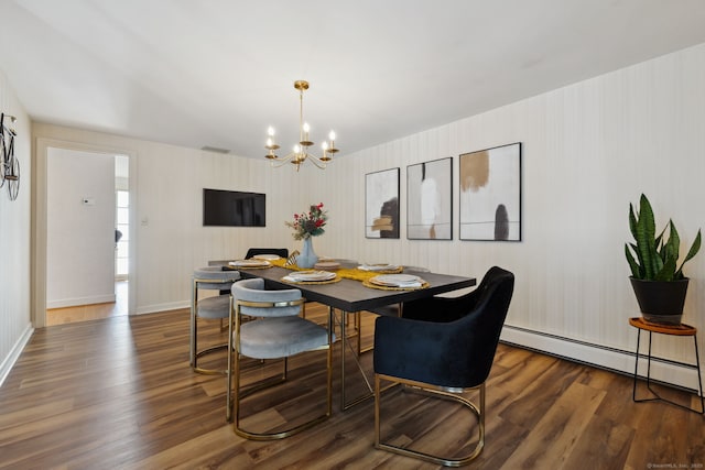 dining area with a chandelier, a baseboard radiator, dark wood finished floors, and baseboards