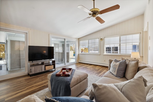 living area featuring lofted ceiling, ceiling fan, baseboard heating, and wood finished floors