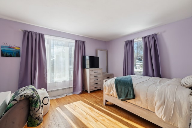 bedroom featuring light wood-type flooring