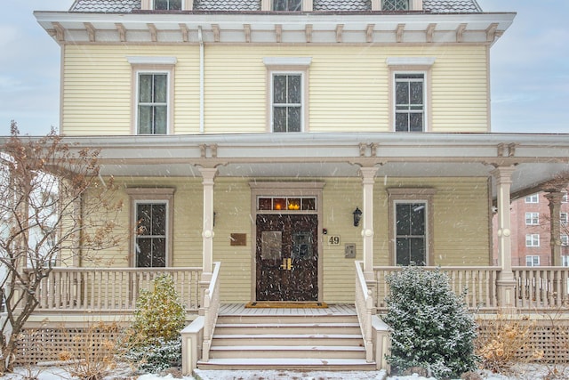 italianate house featuring a porch