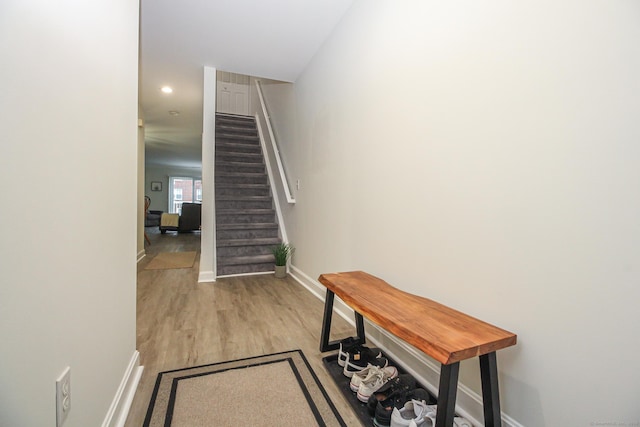 stairs with wood-type flooring