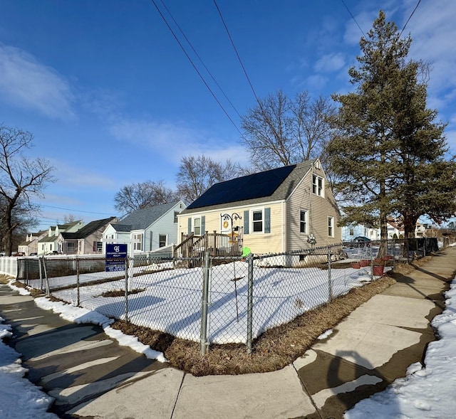 view of front facade with a fenced front yard and a residential view