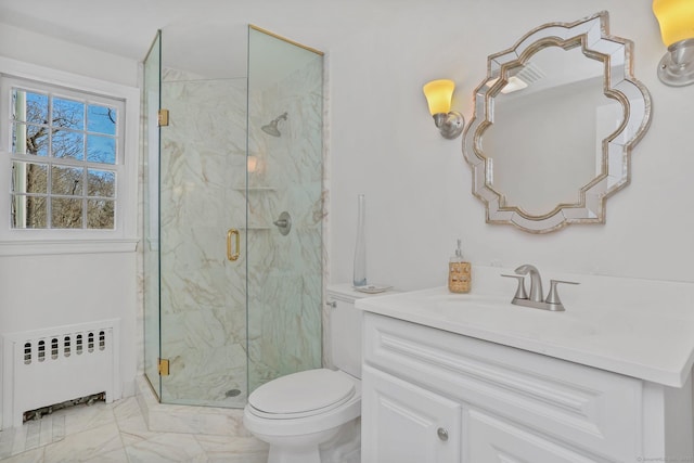 bathroom featuring toilet, vanity, marble finish floor, a marble finish shower, and radiator heating unit