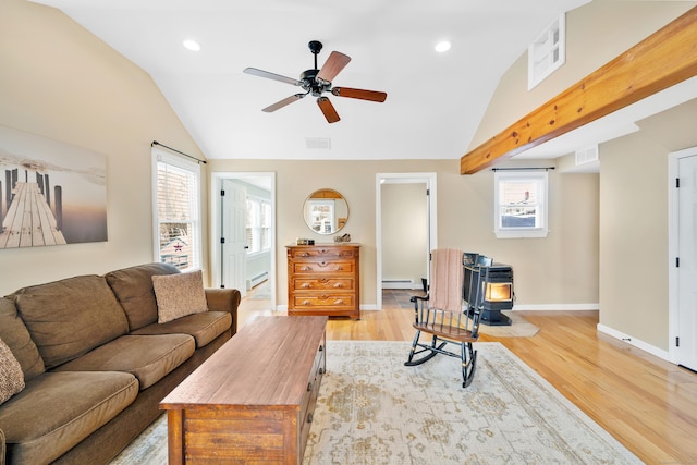 living room with light hardwood / wood-style flooring, a baseboard heating unit, and lofted ceiling